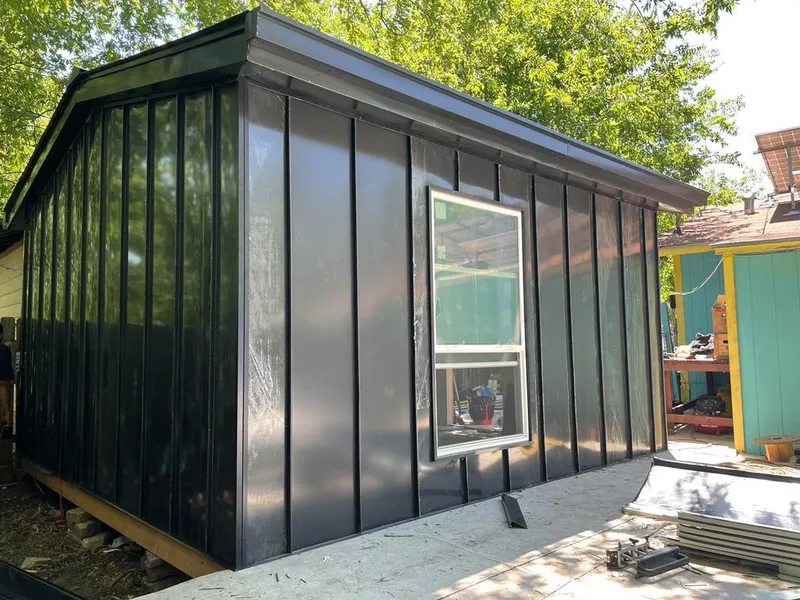 Black standing seam metal wall panels for Metal Roof Installation in Andalusia